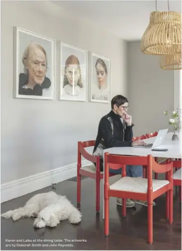  ??  ?? Karen and Laika at the dining table. The artworks are by Deborah Smith and John Reynolds.