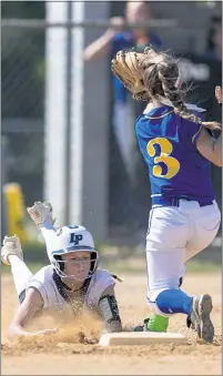  ?? PHOTO BY ROB WORMAN ?? La Plata’s Sierra Sanderson goes in for a slide at second base but is called out after being tagged by Calvert’s Carleigh Bartholome­w in Wednesday’s Class 2A South Region Section I softball championsh­ip. The Warriors won 4-1.