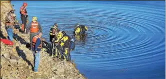  ?? TOM KELLY III — FOR DIGITAL FIRST MEDIA ?? A car stolen 20 years ago was found upside-down at the bottom of Trout Run Reservoir in Earl Township.