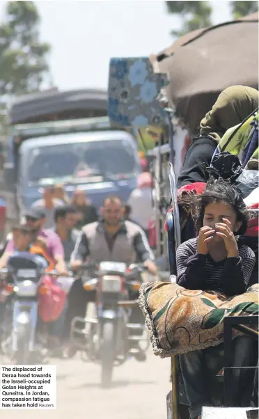  ?? Reuters ?? The displaced of Deraa head towards the Israeli-occupied Golan Heights at Quneitra. In Jordan, compassion fatigue has taken hold