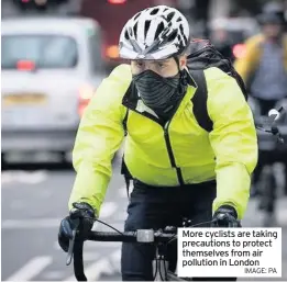  ??  ?? More cyclists are taking precaution­s to protect themselves from air pollution in London