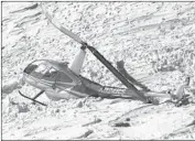  ?? Associated Press ?? VIDEO shows a buckled R44 after it went down on snowy Mt. Baldy in 2016. A few people were injured.