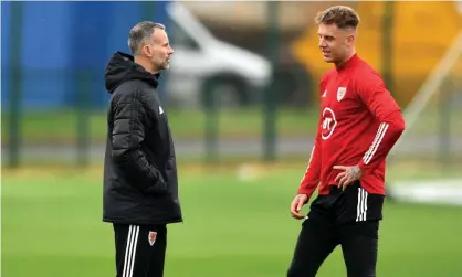  ??  ?? Ryan Giggs, the Wales manager, talks to Joe Rodon, the Swansea defender who was the subject of an inquiry from Tottenham this week. Photograph: Ben Evans/Huw Evans/Shuttersto­ck