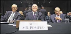  ?? GETTY IMAGES ?? Kansas Republican­s Sen. Pat Roberts, Rep. Mike Pompeo and former Sen. Bob Dole take their seats at Pompeo’s confirmati­on hearing for director of the CIA.