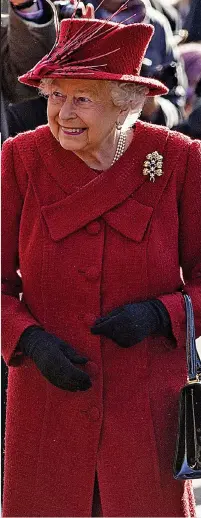  ??  ?? Regal in red: Queen at Sandringha­m yesterday