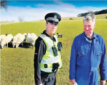  ??  ?? Concerns
Farmer Colin Mair with Constable Graeme Gordon