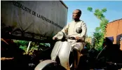  ?? — AFP ?? Seck Seydou poses on his Vespa scooter in Bamako.