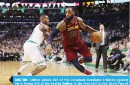  ??  ?? BOSTON: LeBron James #23 of the Cleveland Cavaliers dribbles against Terry Rozier #12 of the Boston Celtics in the first half during Game Two of the 2018 NBA Eastern Conference Finals at TD Garden on Tuesday. — AFP