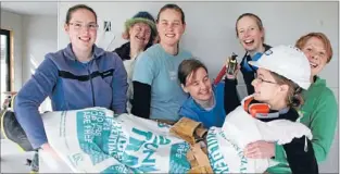  ?? Photo: RUSS FINNERTY ?? Productive party: Lissa Harrop, Alice Wards, Christina Borthwick, Katherine Wharton, Andrea Tucker, bride-to-be Jo Dovey, and Amber Batson larking about inside the Habitat for Humanity home.