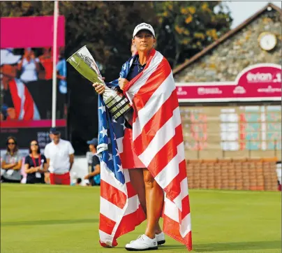  ?? AP PHOTO ?? Angela Stanford of the U.S. poses with her trophy after winning the Evian Championsh­ip women’s golf tournament in Evian, eastern France, Sunday.