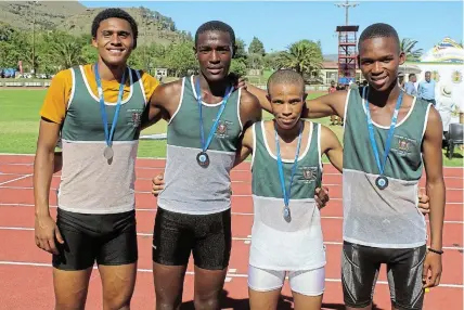  ?? Picture: UVIWE JARA ?? MEDALISTS: Chris Hani West District relay medalists, from left, are Cyndisa Duda, Akhona Ndabazandi­le, Sinonelisi­le Nkompela and Gregan Kerneels.