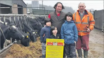  ??  ?? Waterford dairy farmer Padraig O’Brien with young sons and father, Maurice O’Brien, opposed to the developmen­t.