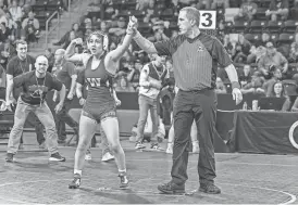  ?? SOPHIA BITTER/SPECIAL TO THE REGISTER ?? Dubuque Wahlert's Bella Miller flexes after a win at the girls state wrestling tournament.