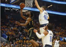  ?? NHAT V. MEYER — BAY AREA NEWS GROUP ?? The Warriors' Andrew Wiggins (22) takes a shot against the Mavericks' Maxi Kleber (42) in the first quarter of Game 1of the Western Conference finals at Chase Center in San Francisco on Wednesday.