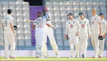  ?? GETTY IMAGES ?? ■
West Indies captain Jason Holder celebrates with John Campbell after winning the 1st Test at The Ageas Bowl on Sunday.