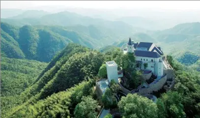  ?? PROVIDED TO CHINA DAILY ?? Naked Castle, a resort developed by the Naked Group, sits atop a hill in the Mogan Mountain area of Deqing, Zhejiang province.