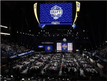  ?? GEORGE WALKER IV — THE ASSOCIATED PRESS ?? NHL teams participat­e in the second day of the draft Thursday in Nashville, Tenn.