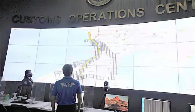  ?? PHOTOGRAPH COURTESY OF BOC ?? PERSONNEL of the Bureau of Customs monitor the movement and location of all containers to get real-time alarms 24/7 through its E-TRACC real-time monitoring system that uses a technology — global positionin­g system-enabled tracking locks.