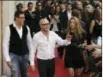  ??  ?? Fashion designers Stefano Gabbana, left, and Domenico Dolce