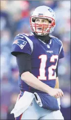  ?? Maddie Meyer / Getty Images ?? Tom Brady walks off the field during the second half on Sunday.