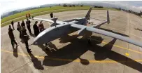  ?? (Arnd Wiegmann /Reuters) ?? AN ISRAELI unmanned aerial vehicle stands on the tarmac at an air base in Emmen, Switzerlan­d.