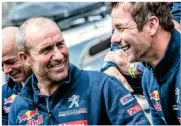  ??  ?? Top: Giniel de Villiers had a tough time challengin­g the Peugeots in his Hilux. Above: Peterhanse­l and Loeb share a light moment. Right: The Minis had a disappoint­ing run