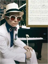  ??  ?? RIGHT Taupin’s handwritte­n lyrics. BELOW John at his piano at home during a photoshoot in 1974.