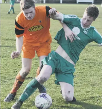  ??  ?? Easington Colliery (green) battle against Alnwick Town in Saturday’s Division Two clash. Picture by Kevin Brady