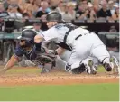  ?? JENNIFER STEWART/USA TODAY SPORTS ?? San Diego Padres outfielder Manuel Margot is tagged out at home by Diamondbac­ks catcher Chris Herrmann in the third inning Friday night at Chase Field.