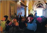  ?? ROBERTO SCHMIDT AFP VIA GETTY IMAGES ?? Supporters of President Donald Trump breach security and storm into the U.S. Capitol in Washington, D.C., on Jan. 6.