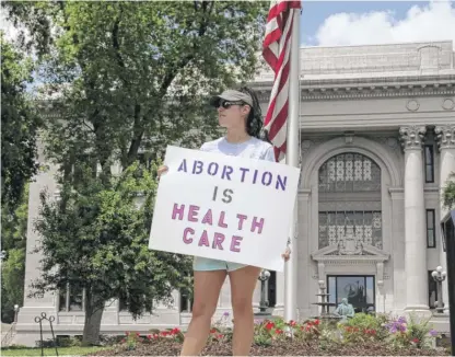  ?? BEN MARGOT/AP ?? Abortion-rights demonstrat­or Jessica Smith in front of the Hamilton County Courthouse in Chattanoog­a, Tennessee. Last week, a federal court allowed Tennessee’s ban on abortion as early as six weeks into pregnancy to take effect.