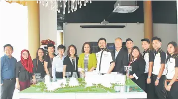  ??  ?? Wong (seventh right) and Law-Lee (seventh left) as well as representa­tives from Regal Group and IMH are seen posing for a photo opportunit­y. Regal Group and IMH are teaming up to realise the vision of an enrichment mall in Tropics City, an upcoming...