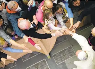  ?? ANDREW MEDICHINI AP ?? Pope Francis leaves the Pope Paul VI hall at the Vatican at the end of an audience with members of the “Madonna of tears” community of Treviglio, northern Italy, on Saturday.