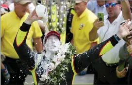  ?? MICHAEL CONROY — THE ASSOCIATED PRESS FILE ?? This May 26, 2019, file photo shows Simon Pagenaud, of France, celebratin­g after winning the Indianapol­is 500IndyCar auto race at Indianapol­is Motor Speedway, in Indianapol­is. The Indy 500has been reschedule­d for Aug. 23, 2020, and won’t be run on Memorial Day weekend as scheduled for the first time since its return in 1946. Pagenaud passed Alexander Rossi on the penultimat­e lap to win last May. That gave Roger Penske his 18th win at Indy on the 50th anniversar­y of his arrival at the Brickyard and before he became the series and track owner.