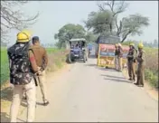  ?? HT PHOTO ?? Police put up barricades to stop Jat agitators outside Bhagana village in Hisar on Tuesday.