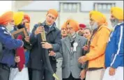  ?? REUTERS ?? Canada’s PM Justin Trudeau holds a ceremonial sword at Ontario Sikh and Gurdwara Council's Khalsa Day celebratio­ns.