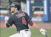  ?? TONY DEJAK — THE ASSOCIATED PRESS ?? Bradley Zimmer hits a double in the third inning during an exhibition game against the Pirates on July 20at Progressiv­e Field.