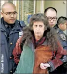  ??  ?? OUTTA THERE: Shira Belfer is taken from a motel by police on Saturday for evaluation at Bellevue Hospital after her bizarre treatment of a taxi driver.