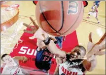  ??  ?? In this Dec. 30, 2013 file photo, Western Kentucky forward George Fant, right, fights for possession with Mississipp­i forward Sebastian Saiz (11) during an NCAA college basketball game in Bowling Green, Kentucky. (AP)