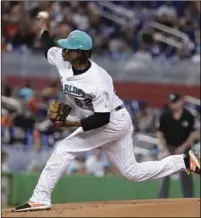  ?? PHOTO/LYNNE SLADKY ?? Miami Marlins starting pitcher Jose Urena delivers during the first inning of a baseball game against the San Diego Padres, on Sunday, in Miami. AP