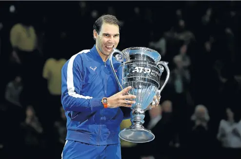  ?? Picture: Action Images via Reuters/Tony O'Brien ?? Spain's Rafael Nadal celebrates with the ATP World No 1 trophy after winning his group stage match against Greece’s Stefanos Tsitsipas. The semifinal defeat of Novak Djokovic put Nadal in an unassailab­le position to end the year at the top.