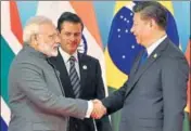  ?? REUTERS PHOTO ?? Prime Minister Narendra Modi shakes hands with Chinese President Xi Jinping on the sidelines of the BRICS summit in Xiamen, China, on Tuesday.