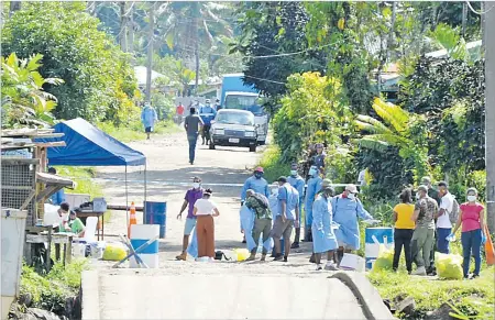  ?? Picture: JONA KONATACI ?? Health Ministry swab teams at Qauia settlement in Lami yesterday.