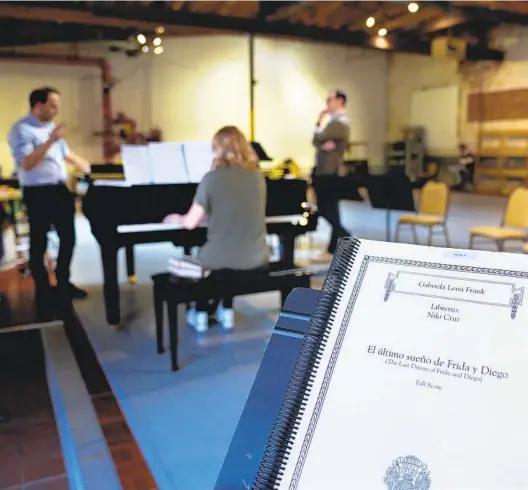  ?? ?? Conductor Roberto Kalb (left), pianist Oxana Bulgakova and bass-baritone Federico De Michelis rehearse at Bread & Salt in Logan Heights.