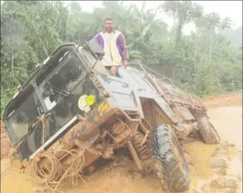  ??  ?? A truck stuck in the mud on the Puruni Road in Region Seven last month