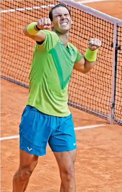  ?? — AP ?? Rafael Nadal of Spain celebrates after defeating Norway’s Casper Ruud in the French Open men’s singles final at the Roland Garros Stadium in Paris on Sunday. Nadal won 6-3, 6-3, 6-0.