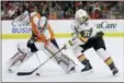  ?? MATT SLOCUM — THE ASSOCIATED PRESS ?? The Flyers’ Petr Mrazek, left, and Vegas Golden Knights’ William Karlsson battle for the puck during the first period of an NHL hockey game, Monday in Philadelph­ia.