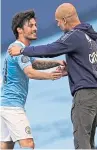  ?? Picture: PA. ?? Manchester City boss Pep Guardiola congratula­tes David Silva after the veteran midfielder made his final league appearance for the club in the 5-0 win over Norwich.