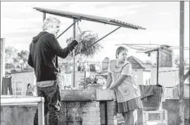  ?? Carlos Somonte Associated Press ?? ALFONSO CUARÓN on the set of “Roma,” which will open in theaters Nov. 21.