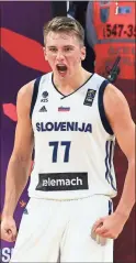  ?? / AP file - Lefteris Pitarakis ?? Luka Doncic, a 19-year-old Slovenian, led Real Madrid to the Euroleague title earlier this week and is expected to be one of the top picks in the NBA draft tonight.